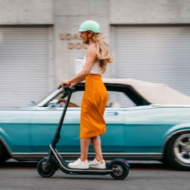 a girl riding a rev in street